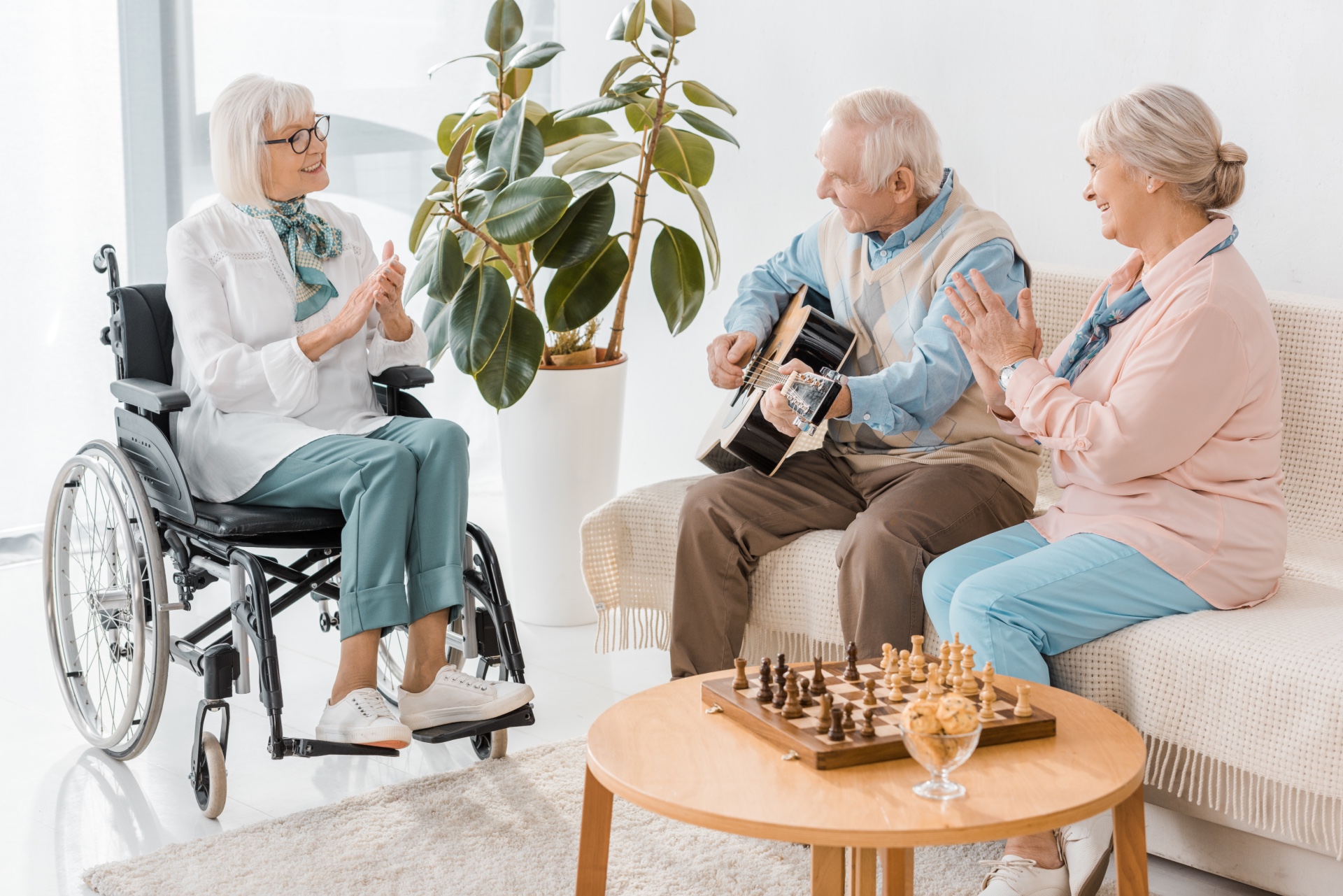 Older adults smiling together in a bright, comfortable senior living community